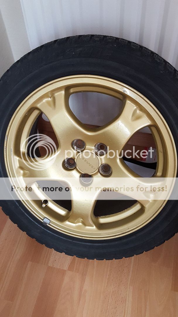 Subaru impreza gold 16" gc8 wheels.